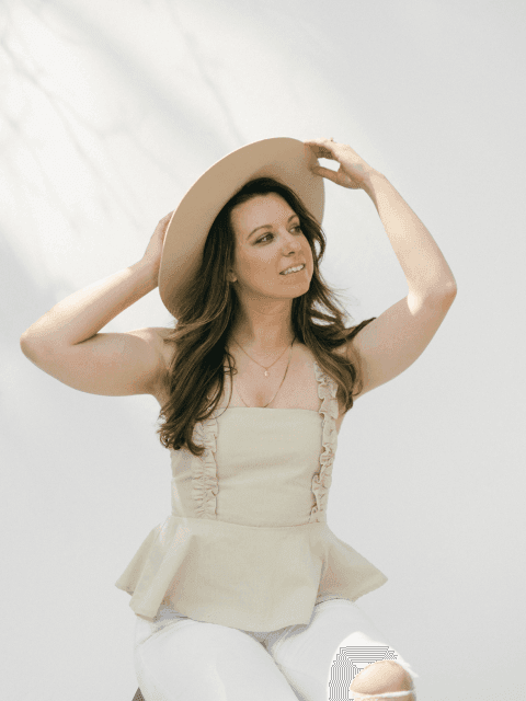 Emily wearing hat on white background